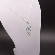 Sterling Silver Double Curve Blue Topaz Pendant Necklace – 18” Trace Chain