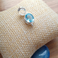 Sterling Silver Faceted Ovel Blue Topaz Pendant Necklace – 18” Trace Chain