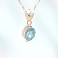 Sterling Silver Faceted Ovel Blue Topaz Pendant Necklace – 18” Trace Chain