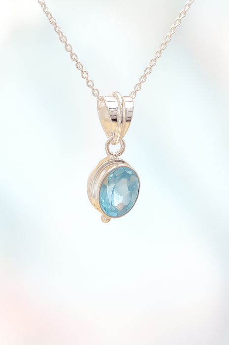 Sterling Silver Faceted Ovel Blue Topaz Pendant Necklace – 18” Trace Chain