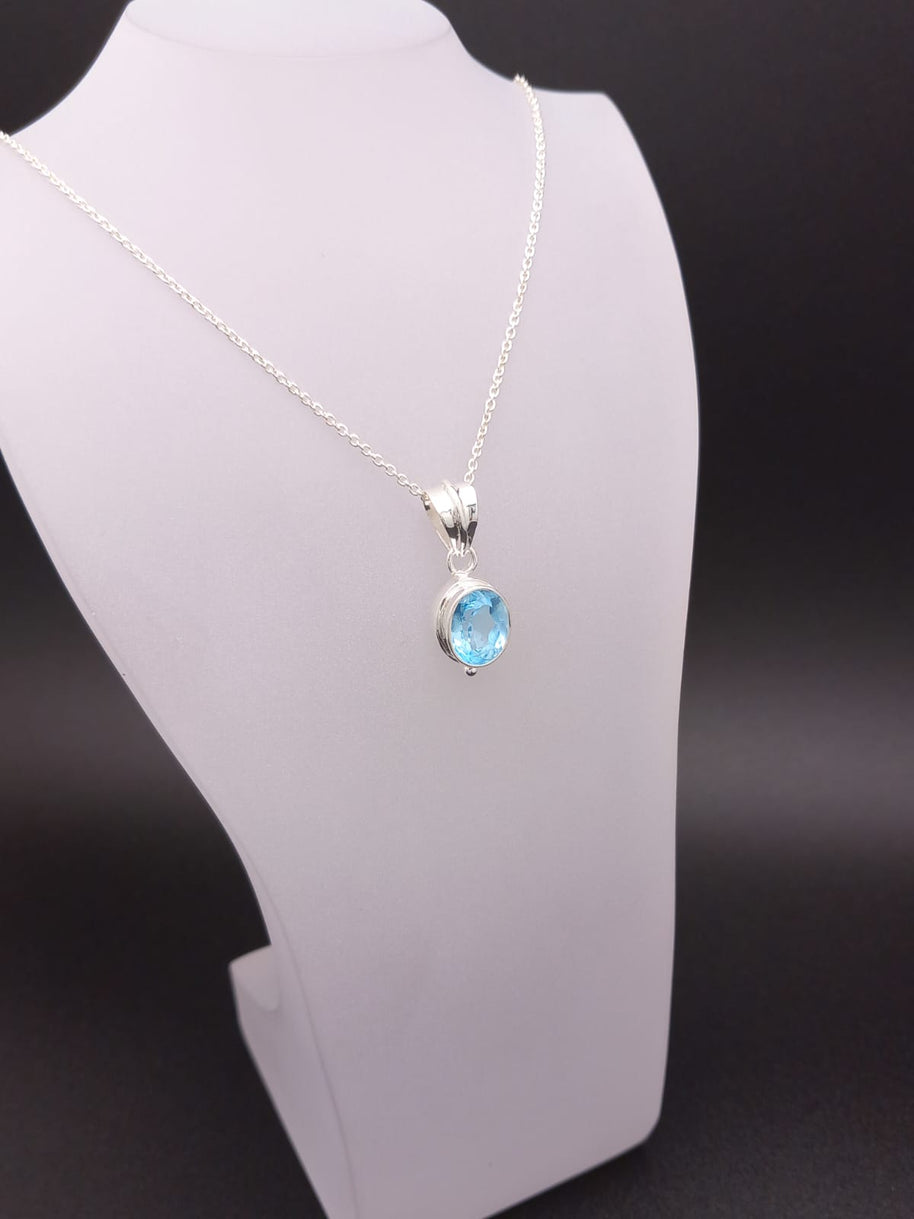 Sterling Silver Faceted Ovel Blue Topaz Pendant Necklace – 18” Trace Chain