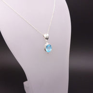 Sterling Silver Faceted Ovel Blue Topaz Pendant Necklace – 18” Trace Chain
