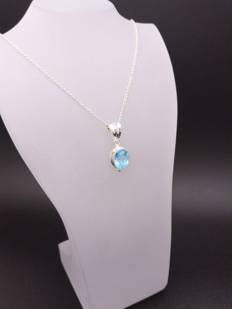 Sterling Silver Faceted Ovel Blue Topaz Pendant Necklace – 18” Trace Chain